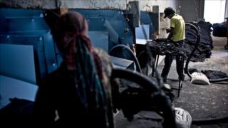 Workers at a sandblasting factory in Bangladesh in March 2010. Photo by Allison Joyce.