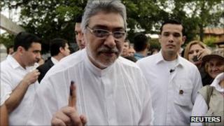Paraguayan President Fernando Lugo displays his inked finger after voting in Asuncion
