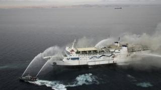 Ferry being hosed down after catching ablaze in the Gulf of Aqaba, 3 November 2011