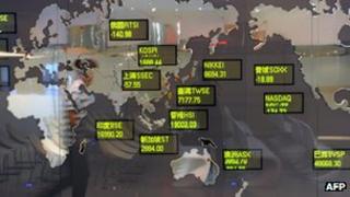 Board showing various stock exchanges in Asia