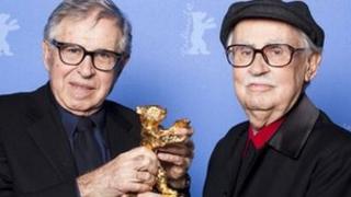 Italian directors Vittorio (R) and Paolo Taviani receive the Golden Bear prize awarded for their film "Caesar Must Die