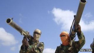 Members of al-Shabab hold their weapons in Somalia's capital, Mogadishu (Archive shot)