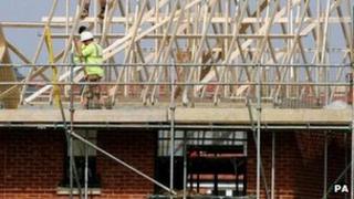 Builders working on a new house