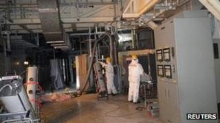 Workers check radiation levels inside the primary containment vessel at Fukushima, 28 March 2012