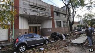 Residents inspect the damage cause by a storm in Buenos Aires