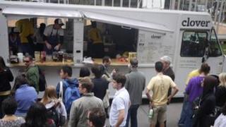 Customers waiting beside a Clover Food Lab truck