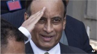 Monday, Jan. 9, 2012 file photo, Pakistan"s former ambassador to the U.S., Husain Haqqani salutes to media as he leaves after appearing before a judicial commission at a high court in Islamabad