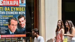 Athens street with magazine ad showing political leaders, 21 Jun 12