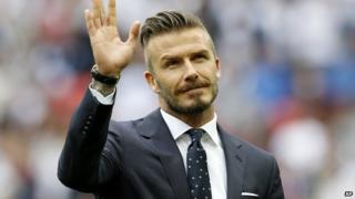 David Beckham waving to crowds