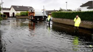 Workers tackle floods