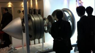 Aerospace and defence officials view hardware at Farnborough
