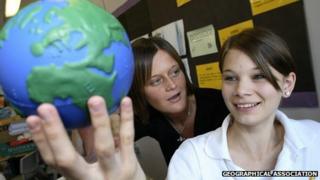Girl holding toy globe