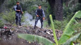 Soldiers standing guard in a plantation of the Bajo Aguan valley - file photo August 2011