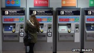 Lady buys a ticket at Clapham Junction
