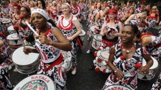 Revellers beating drums at Notting Hill Carnival