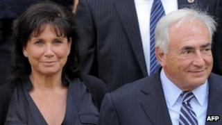 Former IMF head Dominique Strauss-Kahn (R) together with his wife Anne Sinclair leave a hearing at New York State Supreme Court August 23, 2011 in New York.