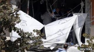 Forensic officers work at the scene of a bomb blast in Istanbul