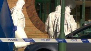 Forensic officers at a bloc of flats in Walsall