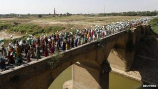 Farmers and members of India"s rural communities participate in a "Jan Satyagraha" march on the national highway at Morena district of the central Indian state of Madhya Pradesh October 5, 2012