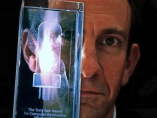 Dr David Link with award