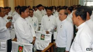 President Thein Sein (second from R) greeting USDP party members in Naypidaw, 14 October 2012