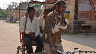 The rickshaw puller with his daughter