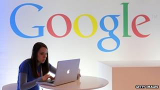 Google employee works on a laptop