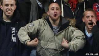 Fan in alleged racist gesture