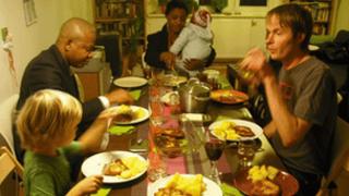 Czech and Nigerian families have lunch together in a Prague flat