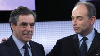 former French Prime Minister Francois Fillon, left, and French conservative party UMP secretary general Jean-Francois Cope pose for photographers