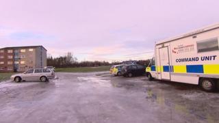 Police vehicles at scene