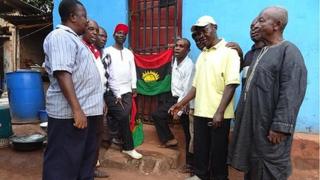 Men sing anthem alongside Biafran flag