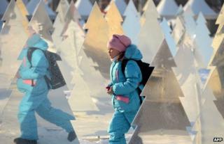 A child walks through Gorky Park, Moscow, 24 December