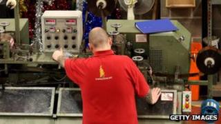 Man in a factory producing tinsel