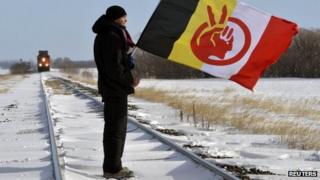 Demonstrator Black Cloud blocks the Canadian National Railway line just west of Portage la Prairie, Manitoba 16 January 2013