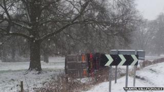 Truck on side in snow by B4030 in Middleton Stoney