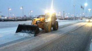 Tractor clearing snow outside Pride Park