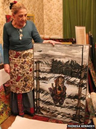 Roma artist and author Ceija Stojka with one of her paintings (image courtesy photographer Theresa Kennedy, from the Forget Us Not documentary, producer Heather E Connell)