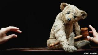 Christie's staff arrange a 1904 Steiff bear, known as Growler, which is believed to be one of the oldest teddy bears in the world