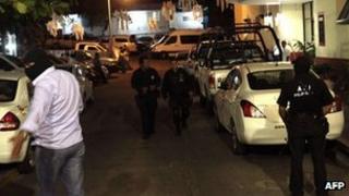 Police seal off the scene of the attack, 5 Feb 2013