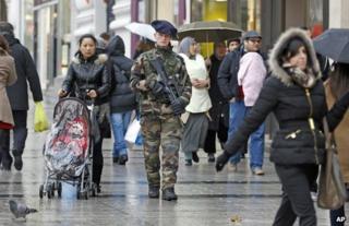 A French soldier patrols a street in Paris, 15 January