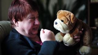 Susan Root with a toy dog