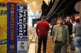Barca and Real Madrid banners on Kurdish street