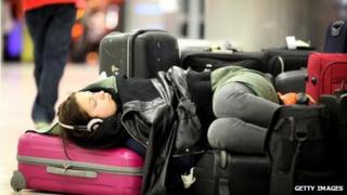Woman sleeping in airport