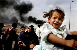 2003 file photo shows Iraqi families leaving Basra in southern Iraq