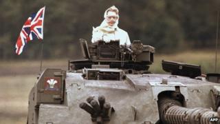 British Prime Minister Margaret Thatcher stands in a British tank during a visit to British forces in Fallingbostel, south of Hamburg, Germany