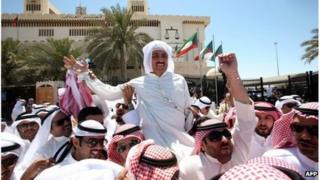 Mussallam al-Barrak, held aloft by supporters outside court in Kuwait city (22/04/13)