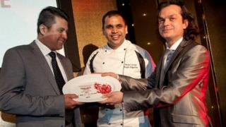 Bengal Spices owner Mizanur Chowdhury and chef Anand George collecting the award in Cardiff on Monday