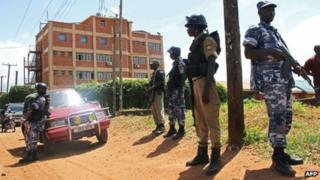 Policemen stand guard outside the Daily Monitor newspaper's offices in Kampala, Uganda, on 20 May 2013