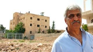 Ali Ayyad stands close to the Cliff Hotel